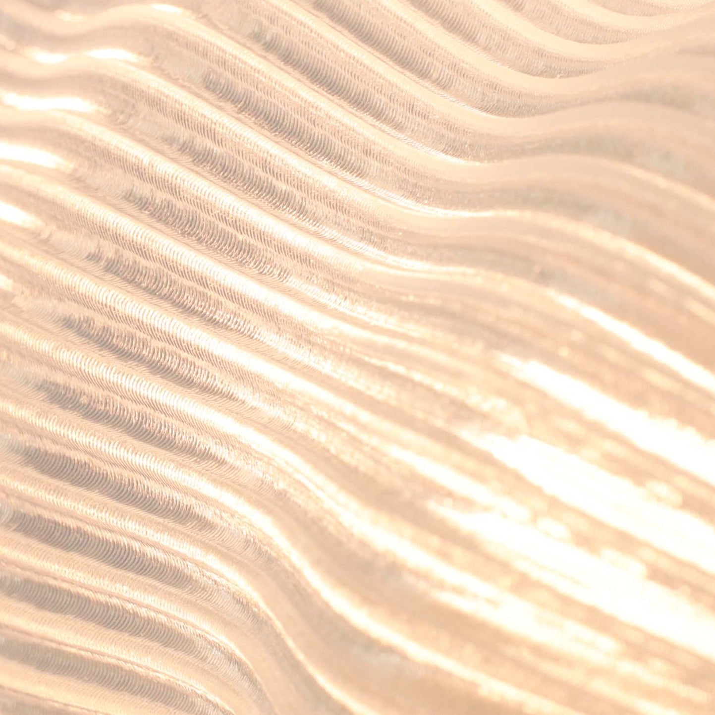 Yuji Table Lamp by Terra Labs featuring a modern design with a sleek base and soft glowing light on a wooden surface.