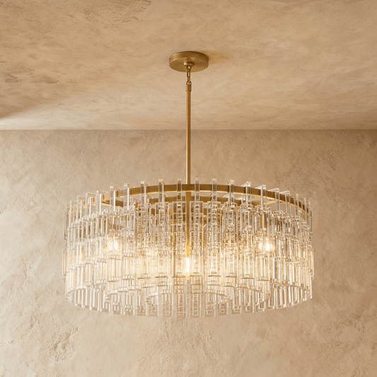 Elegant Yukar Chandelier by Residence Supply featuring intricate metalwork and multiple glowing light bulbs.