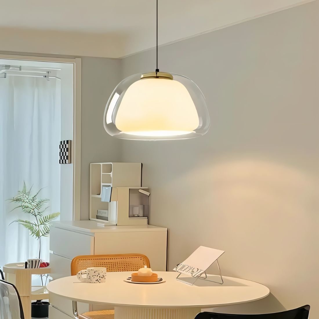 Zabda Pendant Light by Residence Supply hanging from ceiling with a modern design and warm glow, suitable for contemporary interiors.
