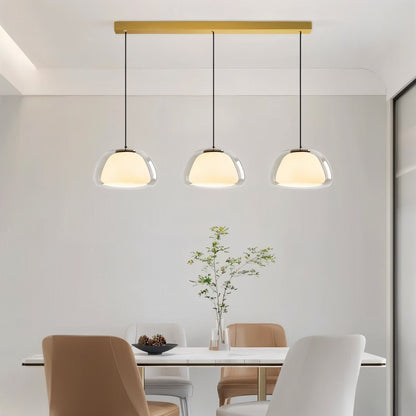 Zabda pendant light by Residence Supply featuring a sleek, modern design with a metal finish and hanging cord for stylish illumination.