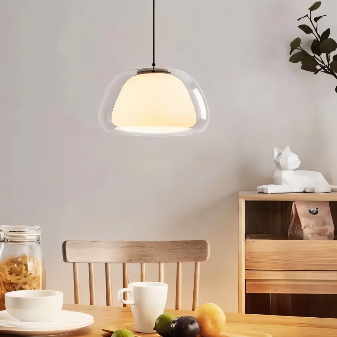 Elegant Zabda Pendant Light by Residence Supply hanging from ceiling with a modern design and warm lighting.