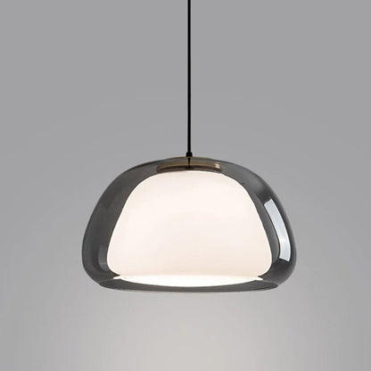 Zabda Pendant Light by Residence Supply hanging with a sleek, modern design and warm illumination for contemporary interior decor