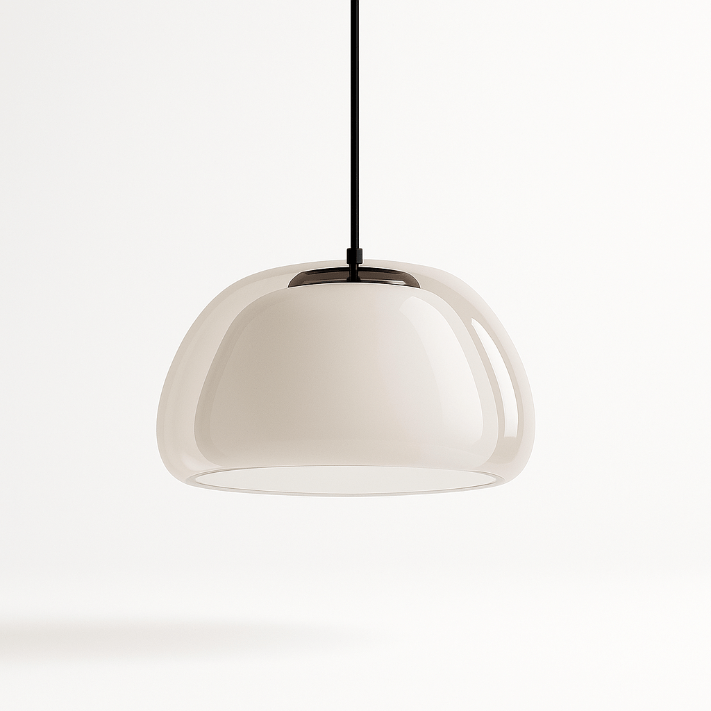 Modern Zabda pendant light by Residence Supply with sleek design and metal finish, hanging from ceiling with a warm glow.