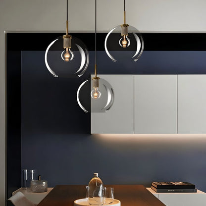 Modern Zafiris Pendant Light by Residence Supply showing a sleek, minimalist design with a metallic finish hanging from a ceiling fixture.