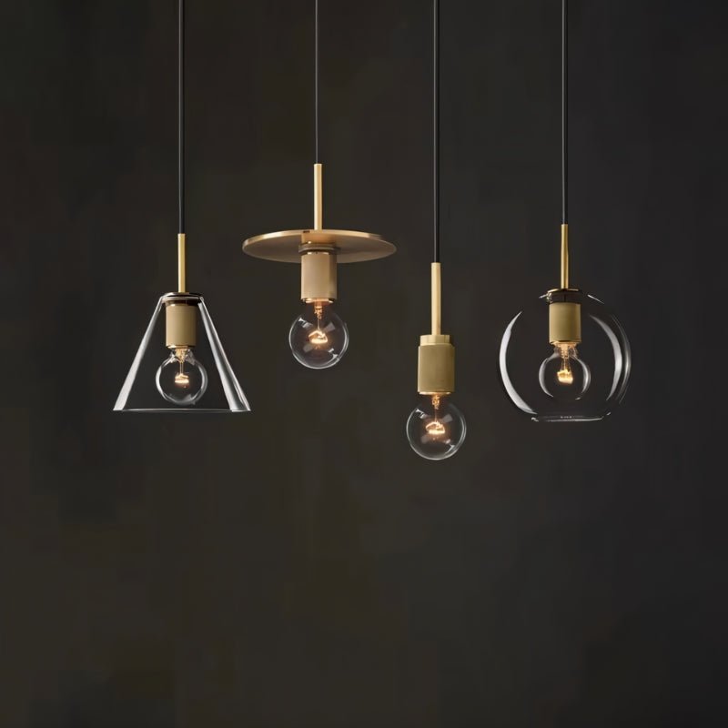 Zafiris Pendant Light by Residence Supply hanging with a sleek, modern design featuring a metal shade and exposed bulb.