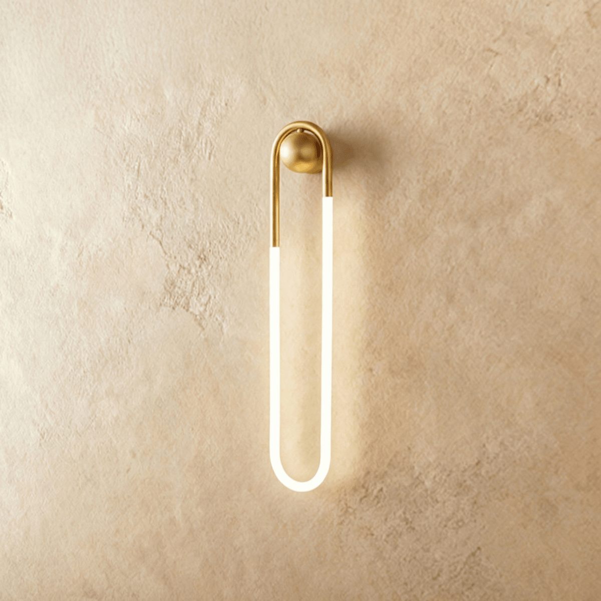 Modern Zenn Wall Lamp by Residence Supply featuring a sleek design with a brass finish and adjustable arm for ambient lighting.