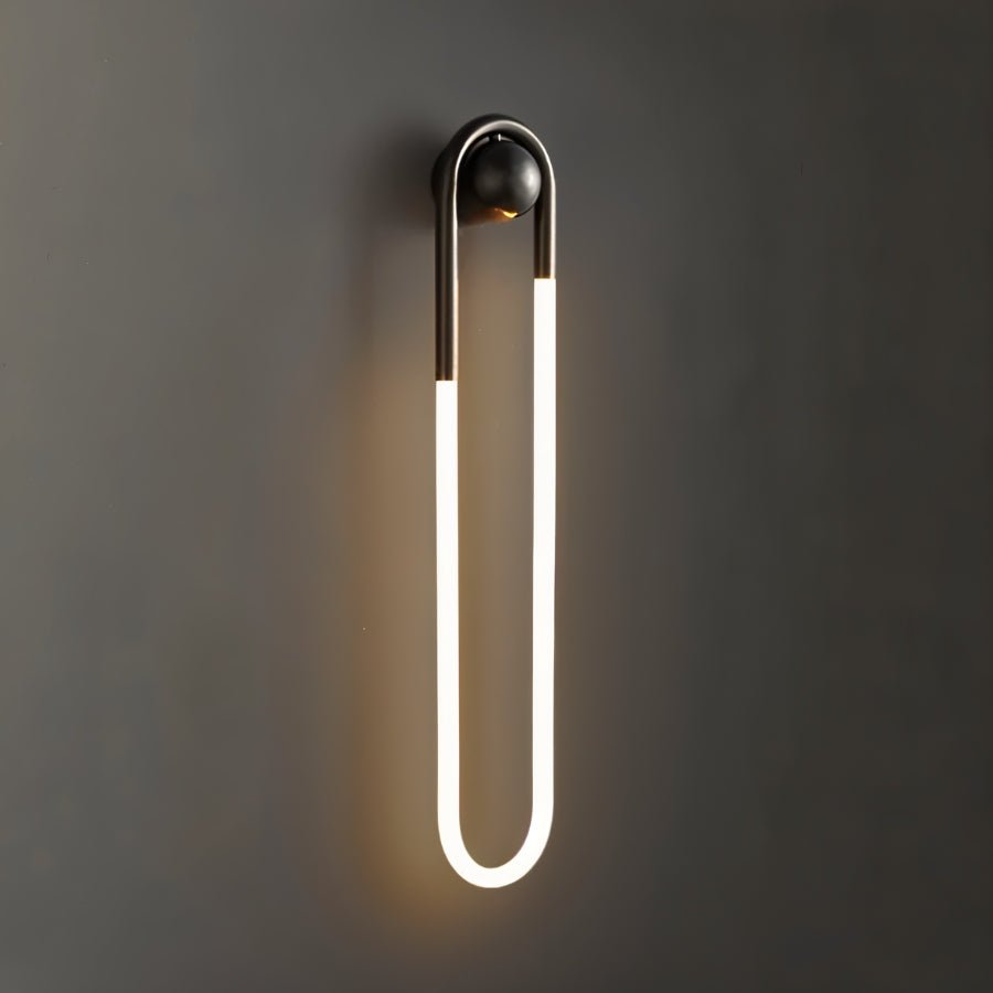 Modern Zenn Wall Lamp by Residence Supply mounted on a wall, featuring minimalist design and ambient lighting.