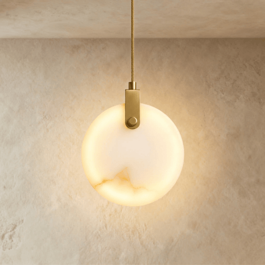 Zenqua Alabaster Pendant Light by Residence Supply, showcasing a smooth alabaster shade hanging from a sleek metal fixture.