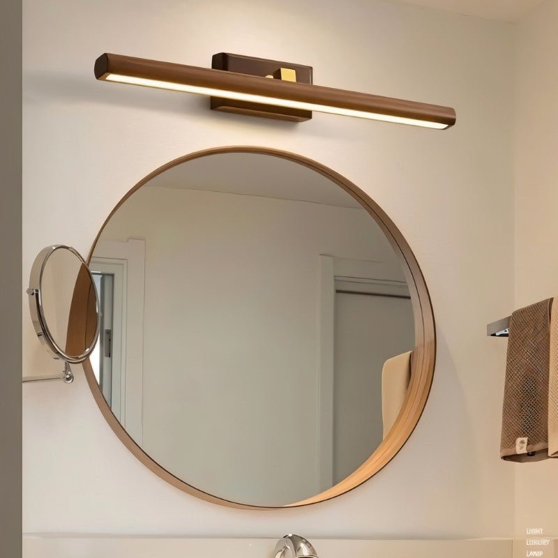 Modern Zoleryn Wall Lamp by Residence Supply with walnut finish, ideal for bathroom vanity lighting, mounted on a wall.